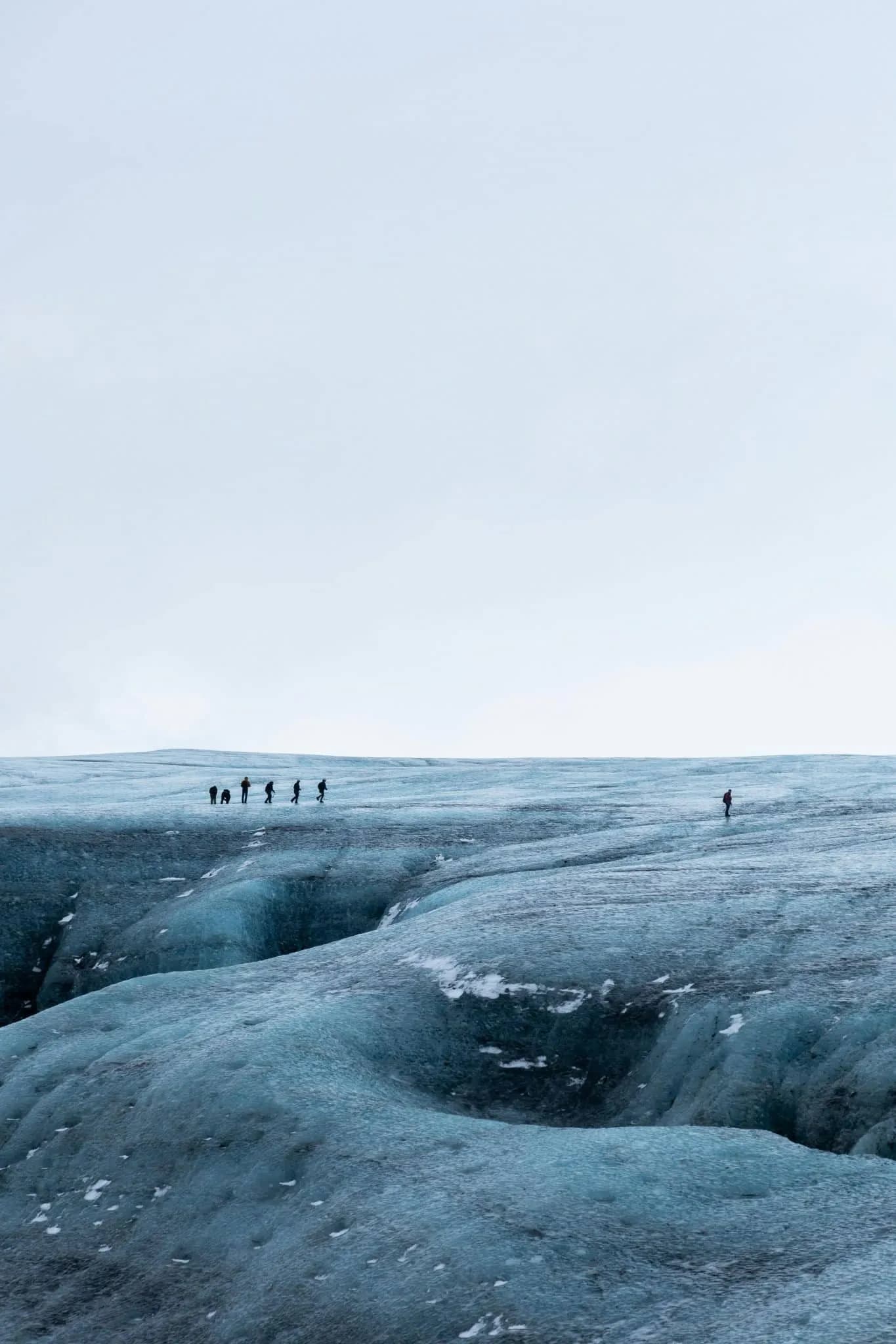 People Walking on Snow Covered Field in Iceland