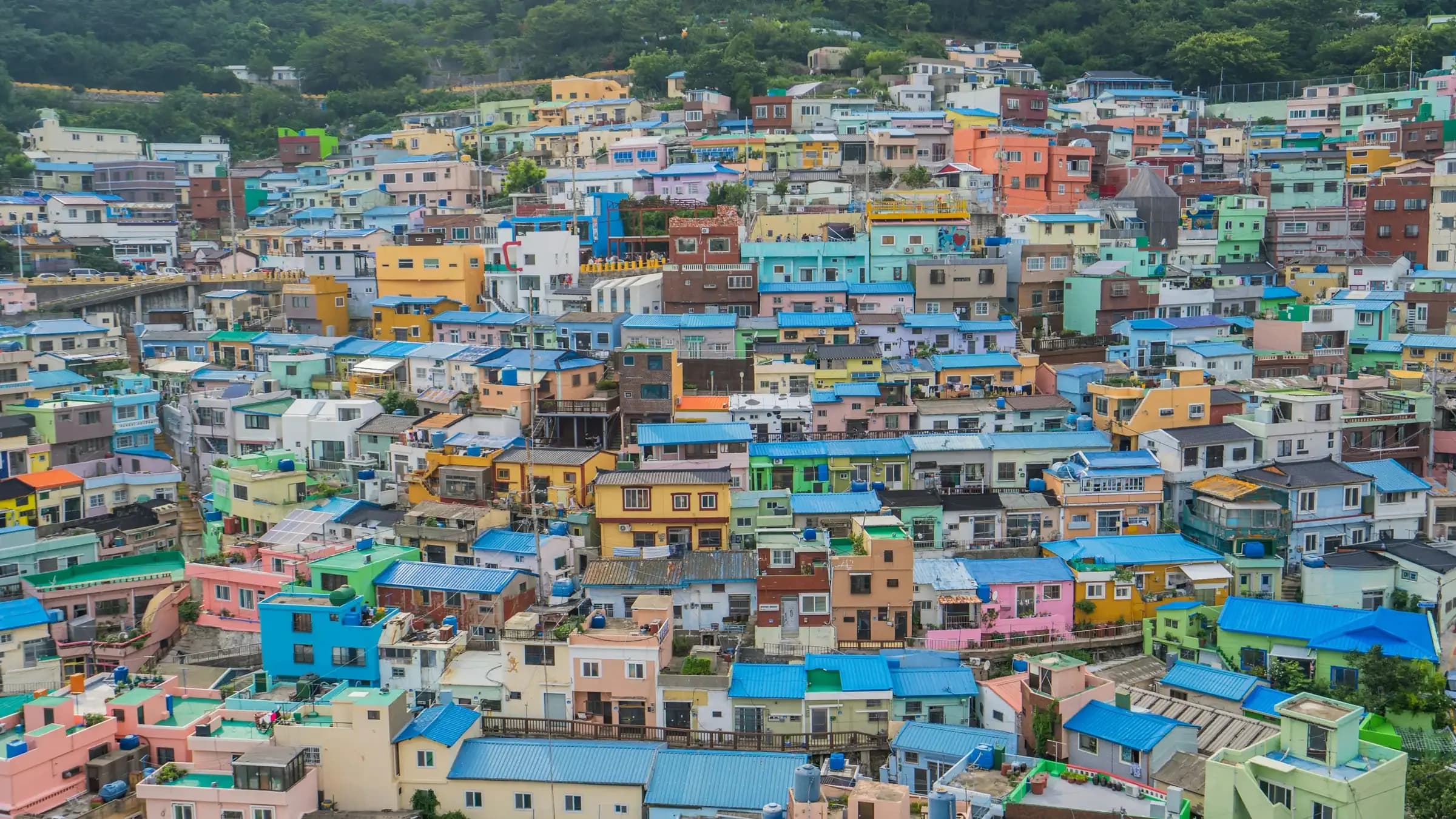 Brightly painted houses stacked up a hillside in Busan's Gamcheon Culture Village.