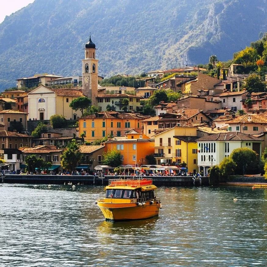 Colorful town of Lake Garda Italy with boat
