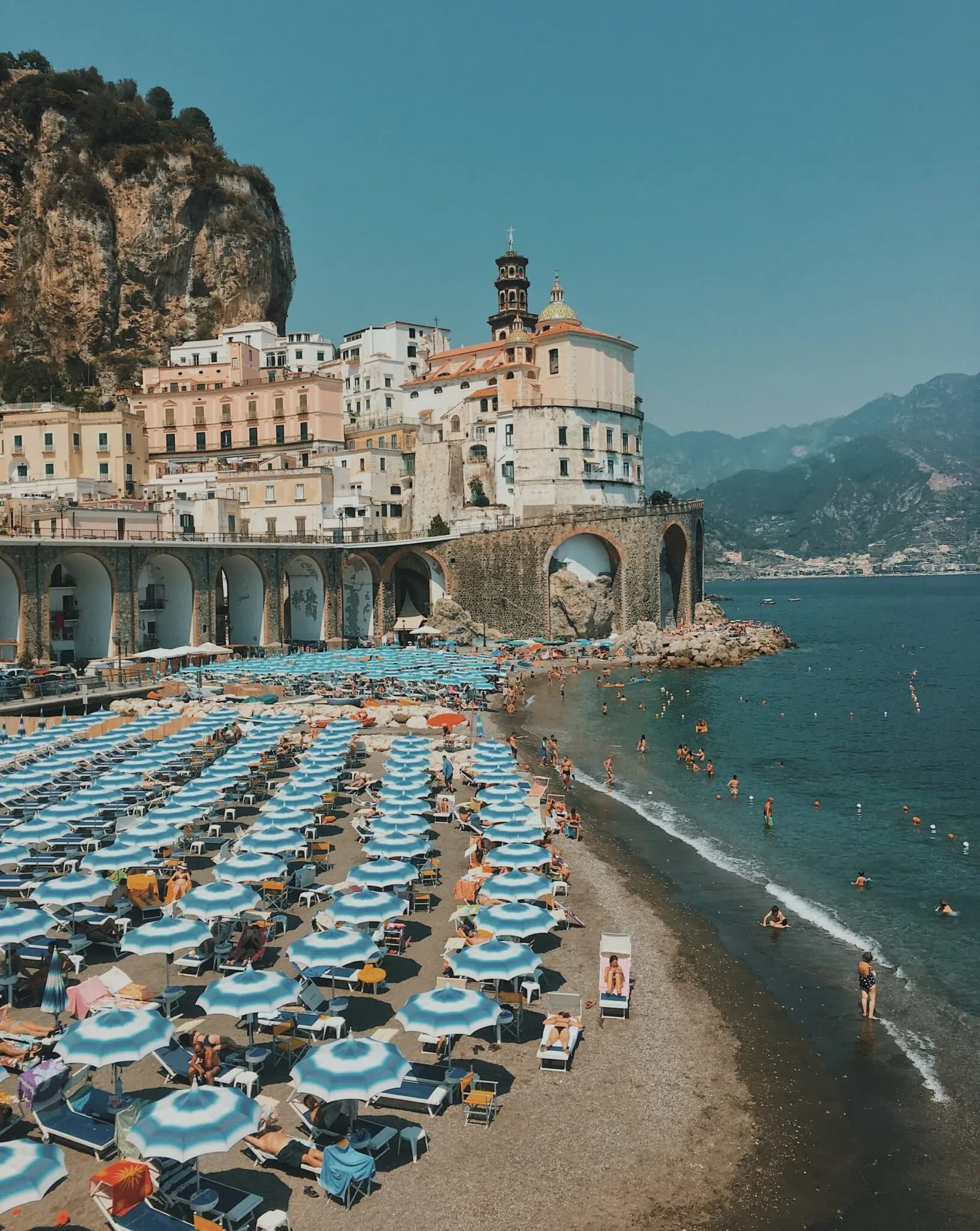 italian coastline with umbrellas
