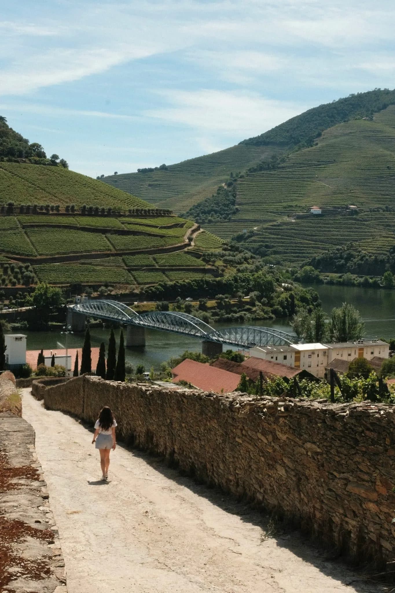 Girl walking on a bridge in Douro, Portugal