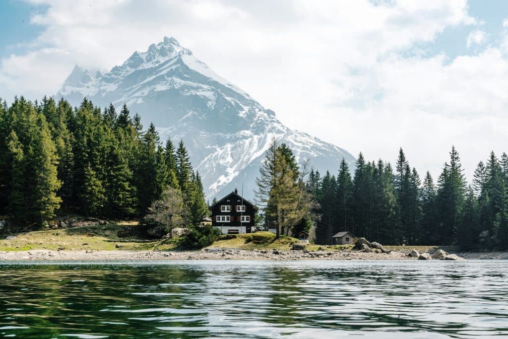 House on a lake in Arnisee, Gurtnellen, Switzerland