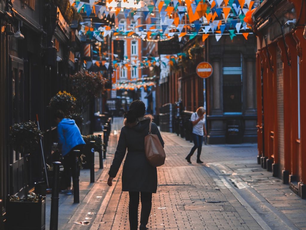 Lady walking the streets of Dublin Ireland cropped