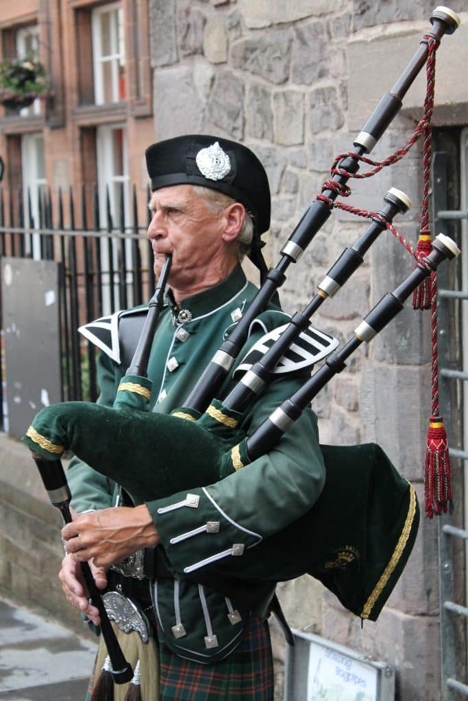 Bagpiper playing in Scotland