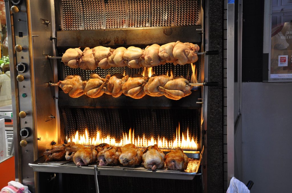 Chicken on rotisserie in Paris Restaurant