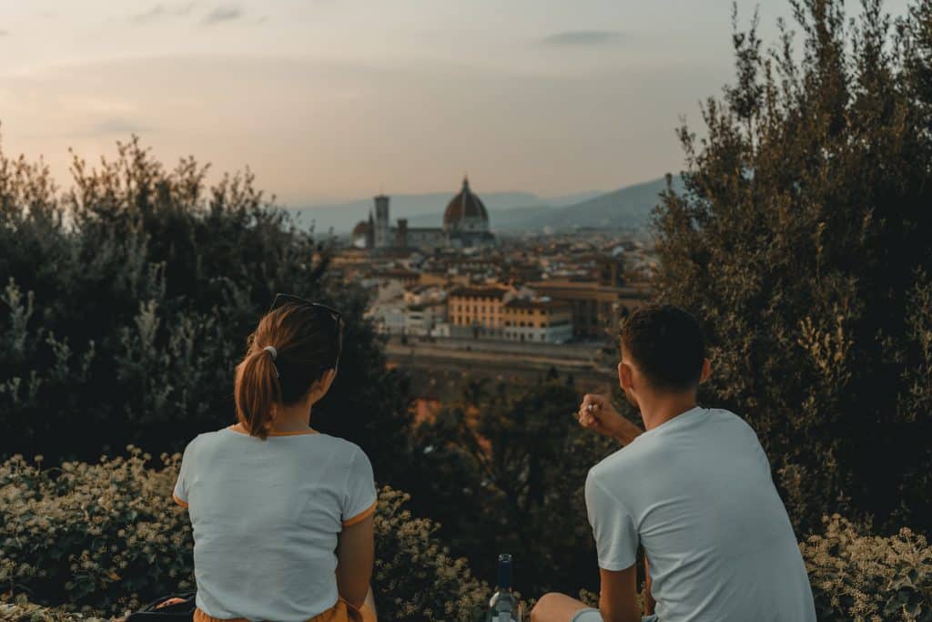 Couple sitting together overlooking European city
