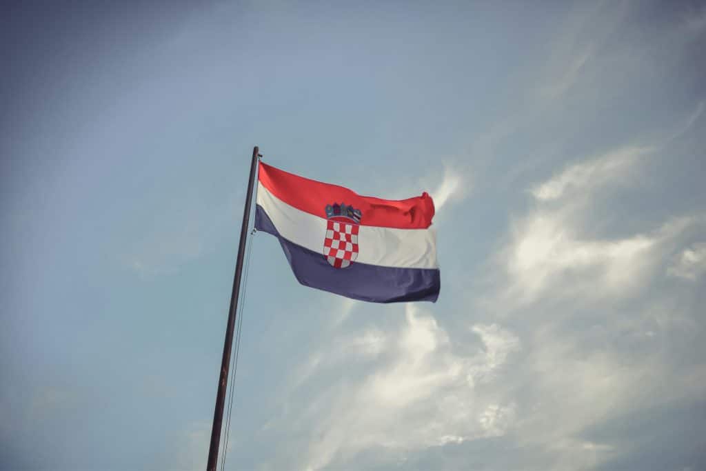 Croatian flag against blue cloudy sky