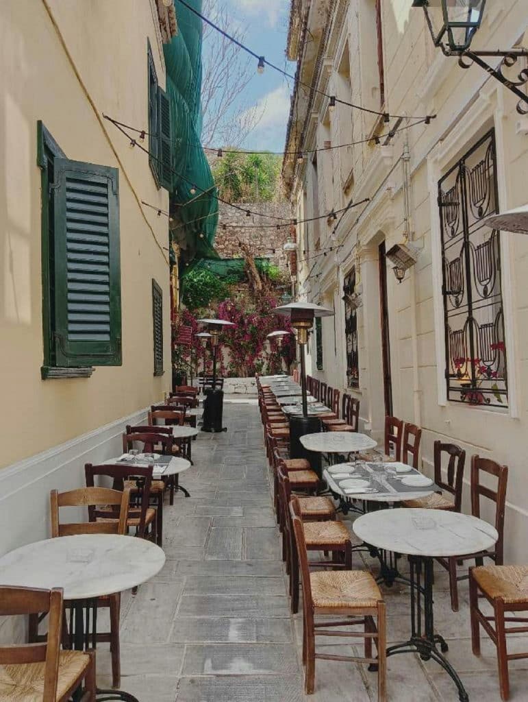 Chairs and Tables of Cafe in Narrow Alley in Athens, Greece
