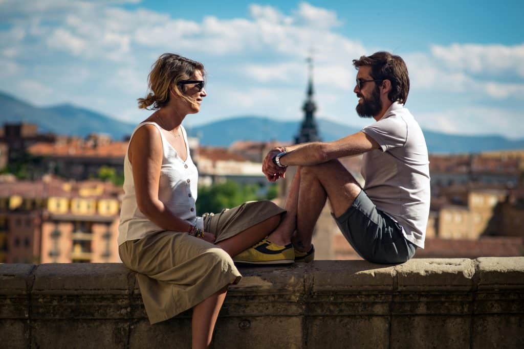 Man and Woman Sitting on Concrete Bench, Segovia, CL, Spain