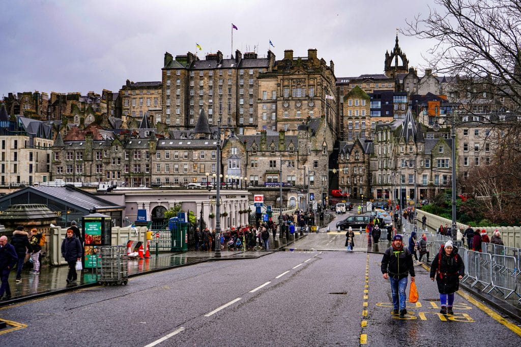 People Walking on Waverley Bridge on a Rainy Day, Edinburgh, Scotland, UK