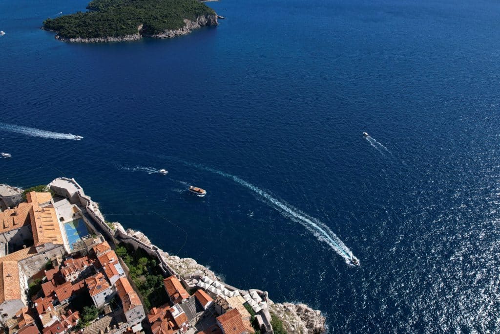 Boat cruising along the coast of Dubrovnik, Croatia